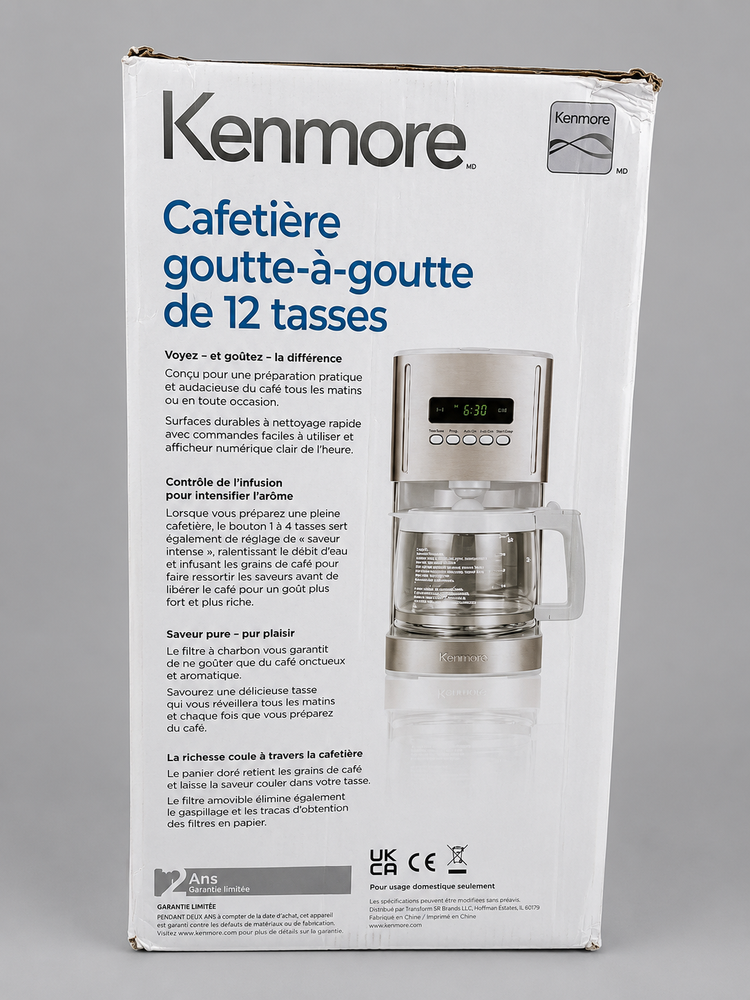 Rear view of the original retail packaging for the Kenmore 12 Cup Programmable Filter Coffee Machine. The packaging displays product features, brewing technology, specifications and manufacturer information, helping customers view the original box and included product details before purchase.