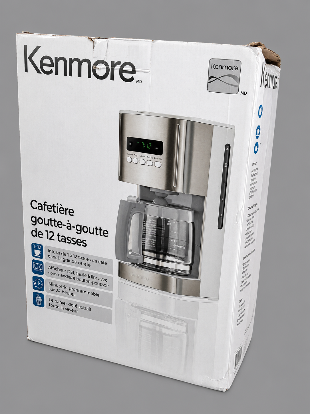 Retail packaging of the Kenmore 12 Cup Programmable Filter Coffee Machine featuring the white 1.8L programmable drip coffee maker with digital controls, reusable gold-tone filter and glass carafe. Ideal for customers to view the original product packaging before purchase.