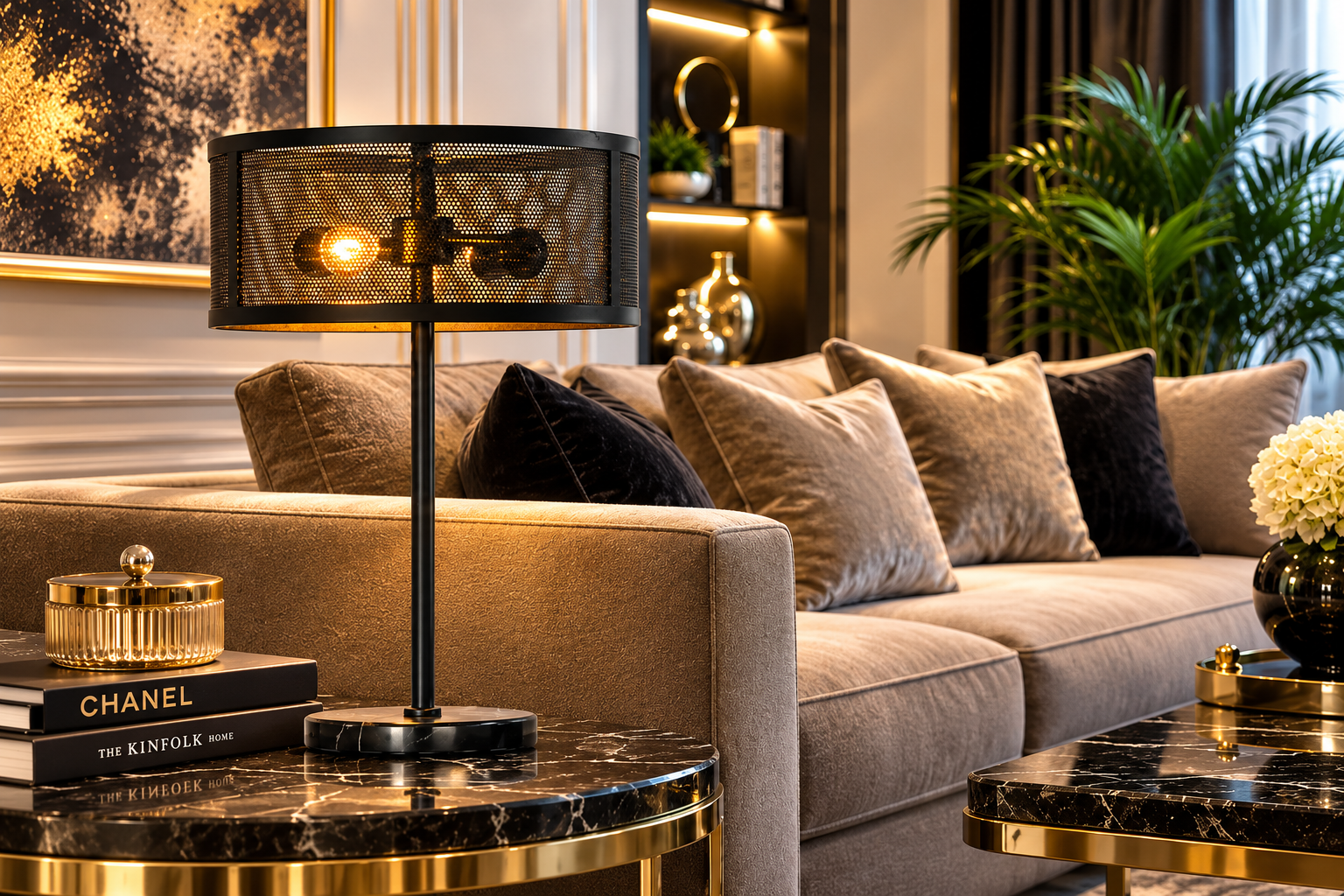 A modern black metal mesh table lamp with two exposed bulbs, styled on a round black marble side table in a luxurious living room setting.